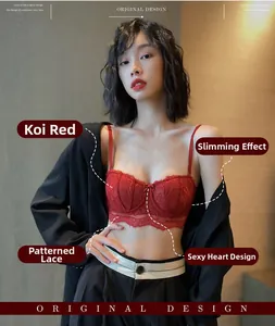 Gros plan d'un soutien-gorge en dentelle rouge avec armatures sous une veste noire