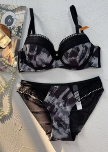 Detail of push-up lingerie set with marble print, lace trim, and sparkly rhinestone accents