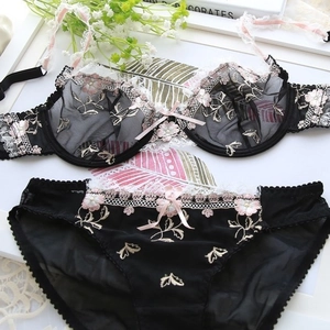 Sheer black mesh lingerie set with pink floral embroidery and delicate lace trim