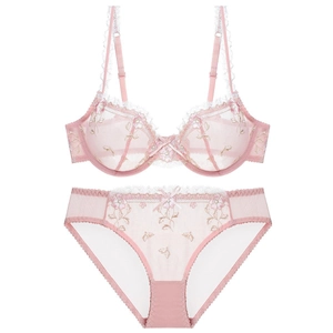 Pink lace embroidery lingerie set with sheer mesh bra and matching panties on white background