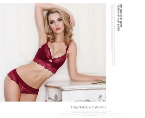 Lace lingerie set in burgundy featuring eyelash trim and elegant pearl details