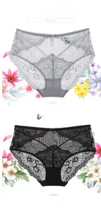 Close-up of floral lace texture and delicate bow on sheer high waist underwear