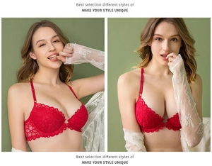 Detail of red lace bra featuring front closure and intricate floral embroidery textures