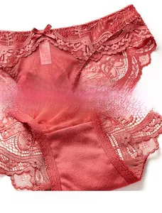 Detail of red floral lace panties with satin bow and breathable cotton crotch lining