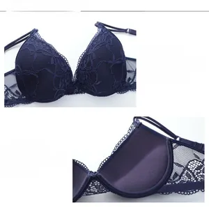 Detailed macro view of 3/4 navy blue lace cups with soft push-up cotton lining