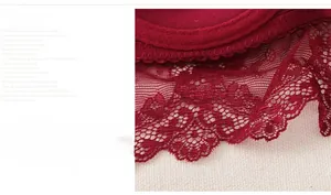 Detailed close-up of dark red floral lace on a supportive full cup bra with scalloped edges