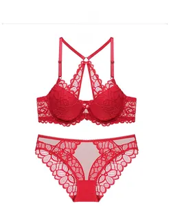 Detailed view of red lace lingerie set with elegant back cross strap design and floral lace