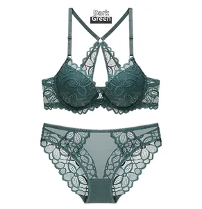 Detailed view of dark green lace lingerie set with elegant floral embroidery patterns