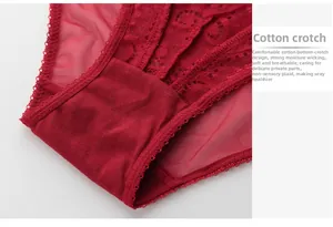 Detail view of red lace lingerie brief featuring a breathable cotton crotch for comfort