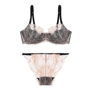 Elegant black and pink lace lingerie set with unlined cups and floral patterns