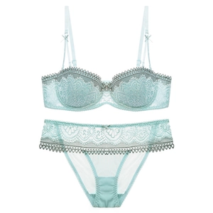 Lace lingerie set in mint green with thin cups and adjustable straps on white background
