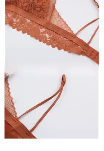 Detailed view of elastic floral lace hem and dual adjustable straps on the back of the bra