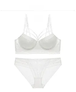 Detailed view of white floral lace lingerie set with elegant multi-strap design details