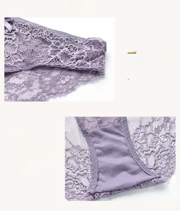 Detail of lavender lace panties with floral embroidery and satin bow decoration