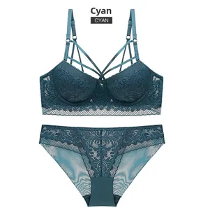 Detailed view of cyan lace lingerie set featuring multi-strap cross design and mesh fabric