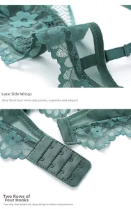 Close-up of dark green floral lace wings and two-row four-button adjustable back closure