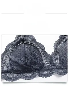 Close-up of semi-sheer floral lace fabric with delicate scalloped edges on dark grey bra