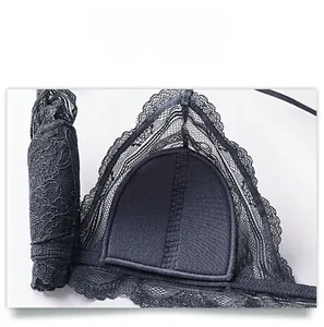 Detail view of the soft cotton inner cup and fine floral lace of the black bralette