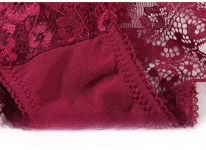 Macro shot of fine lace craftsmanship and durable double-stitched seams in wine red