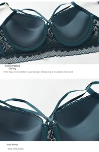 Detailed macro view of dark green lace bra with push-up cup and strappy crisscross design