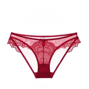Close-up of wine red lace underwear with sheer mesh texture and a small bow detail