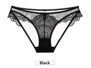 Detail of sheer black floral lace panties with a small delicate bow on low-rise waistband
