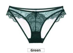 Detail of green sheer lace panties with floral embroidery and bow accent for women
