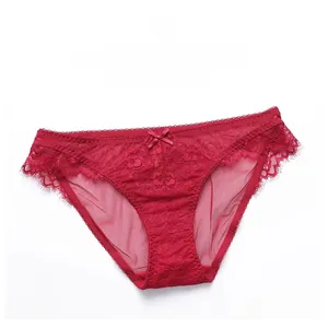 Detail of red sheer lace panties with eyelash lace trim and a small bow detail