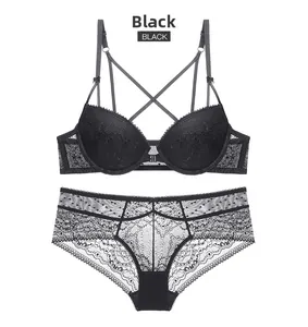 Detailed view of black floral lace bra set with front closure and cross straps