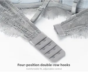 Detailed macro view of 4-row 2-hook closure and eyelash lace on a light blue bra