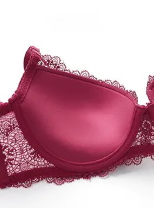 Detailed close-up of dark red lace bra showing smooth skin-friendly inner cup texture