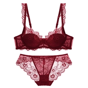 Elegant wine red lace lingerie set with floral patterns and scalloped edges on white background