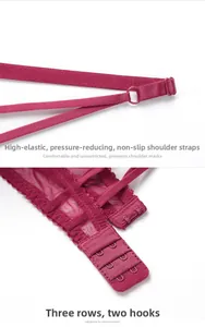 Detail of burgundy lace bra showing anti-slip elastic straps and three-row hook-and-eye closure