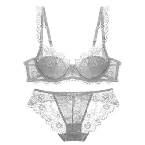 Detailed close-up of light gray floral lace lingerie set with delicate eyelash trim