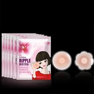 Detailed view of round and flower shaped silicone nipple covers with pink packaging
