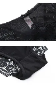 Detailed view of sheer black lace panties featuring a cotton crotch and bow detail