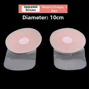 Detail of round beige silicone nipple covers 10cm diameter with lifting tape 1 pair