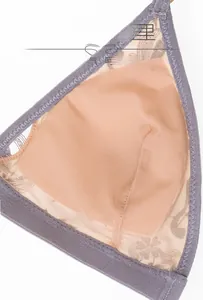 Detail of breathable ultra-thin mesh cup lining and lace edging on a wireless bra