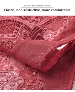 Macro detail of red floral lace panties showing breathable mesh fabric and elastic edges