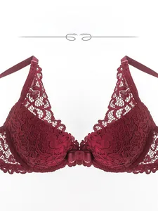 Detail of red floral lace bra with intricate patterns and small ribbon bow detail