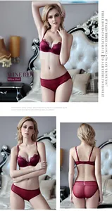 Detail of wine red lace lingerie set featuring satin finish and fine embroidery