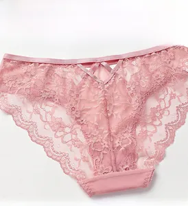 Detailed close-up of pink floral lace panties featuring a unique V-shaped cross waist design