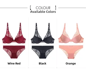 Three-color display of lace lingerie sets in red, black, and orange with delicate details