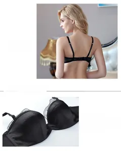 Detail view of black lace satin half-cup bra with delicate mesh trim and adjustable straps