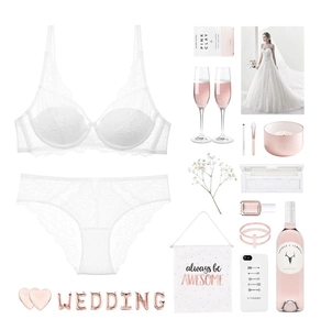 Detailed view of white floral lace lingerie set with wedding themed accessories