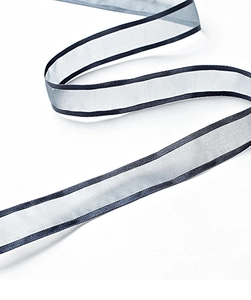 Detail of sheer satin ribbon featuring silver mesh fabric and dark contrast trim edges