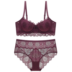 Detailed view of dark purple lace lingerie set with geometric patterns and sheer fabric