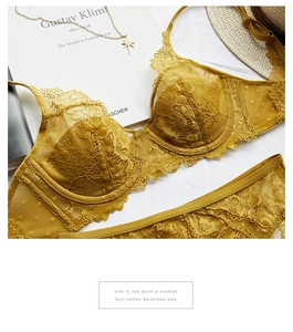 Detailed flat lay of mustard yellow floral lace lingerie set with eyelash lace edging
