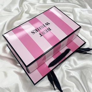 Pink and white striped gift box and shopping bag set with Best Wishes text on satin background