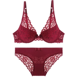 Red floral lace lingerie set with underwire bra and matching bow-decorated panties